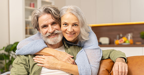 Happy senior couple in the living room photo