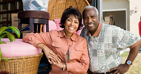 Senior couple leaning on the furniture photo